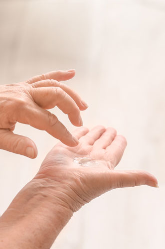 applying cream on hands