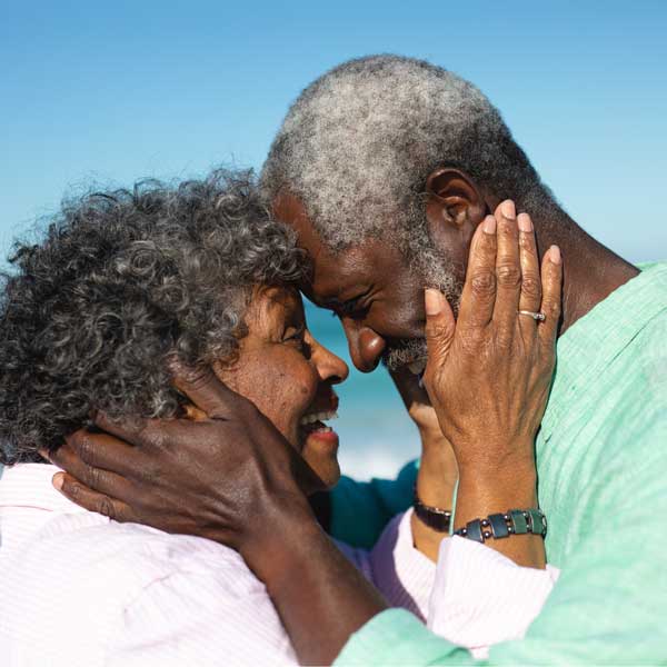 couple holding each others faces